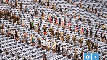 UNC-Chapel Hill community members climbing up stadium steps at Kenan Stadium at a 9/11 Memorial Climb.